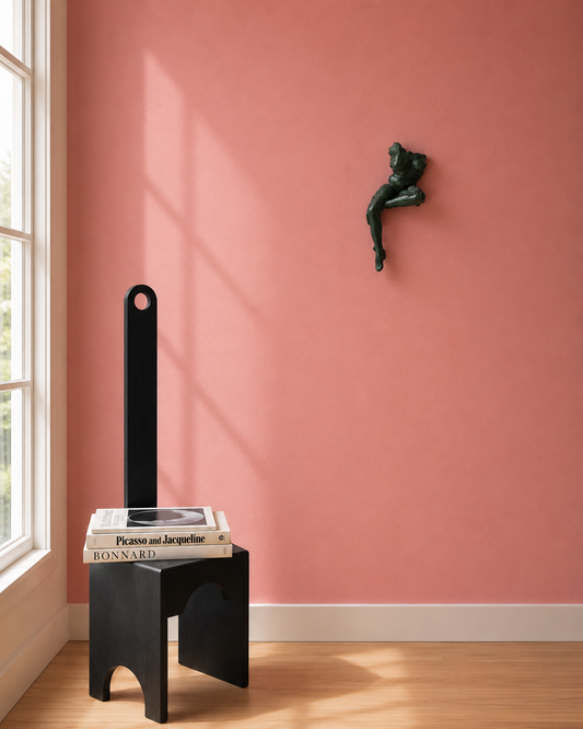 Scupture by Gina NOvendstern titled Frgament at Marcolina's Fine Art Gallery in Tampa shown hanging in a room with natural light next to a chair and stack of art books.