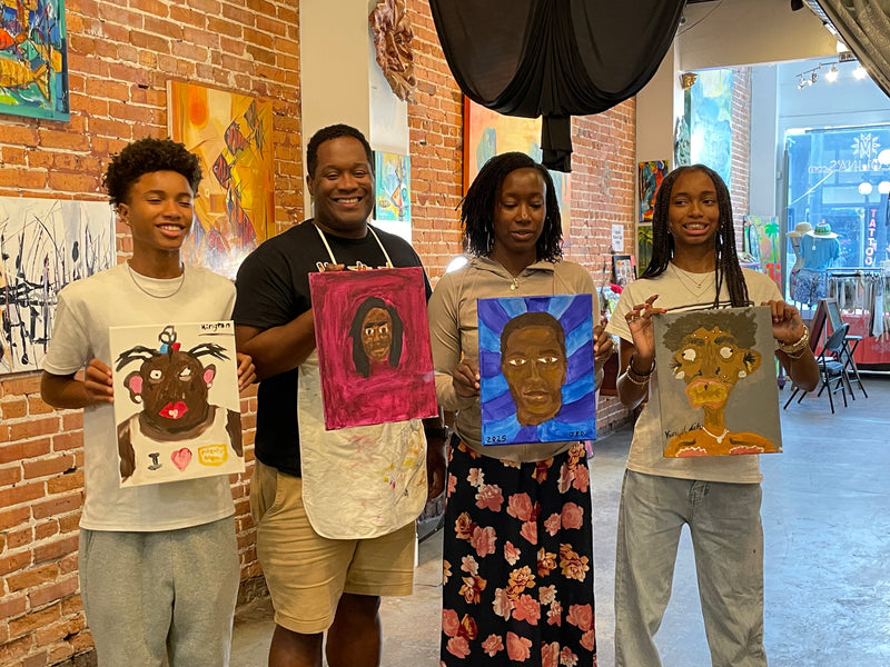 Family showing portrait paintings Marcolina's Tampa