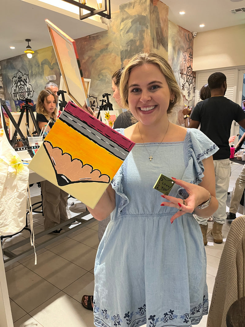 Guests enjoying a private sip and paint experience at a community venue with Marcolina's Tampa