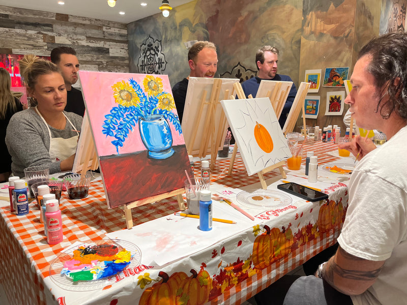 Guests painting and creating together at a private event with Marcolina's Fine Arts Gallery